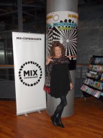 Rebecca Holm i Cinemateket ved plakater for filmfestivalen arrangeret af MIX Copenhagen.